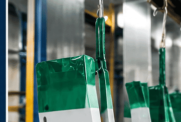 Components using green tape during an industrial finishing process