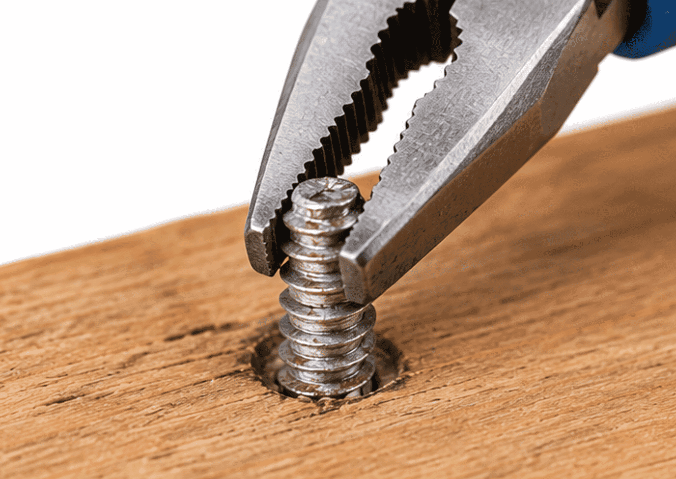 Pliers gripping an exposed screw shaft with no head