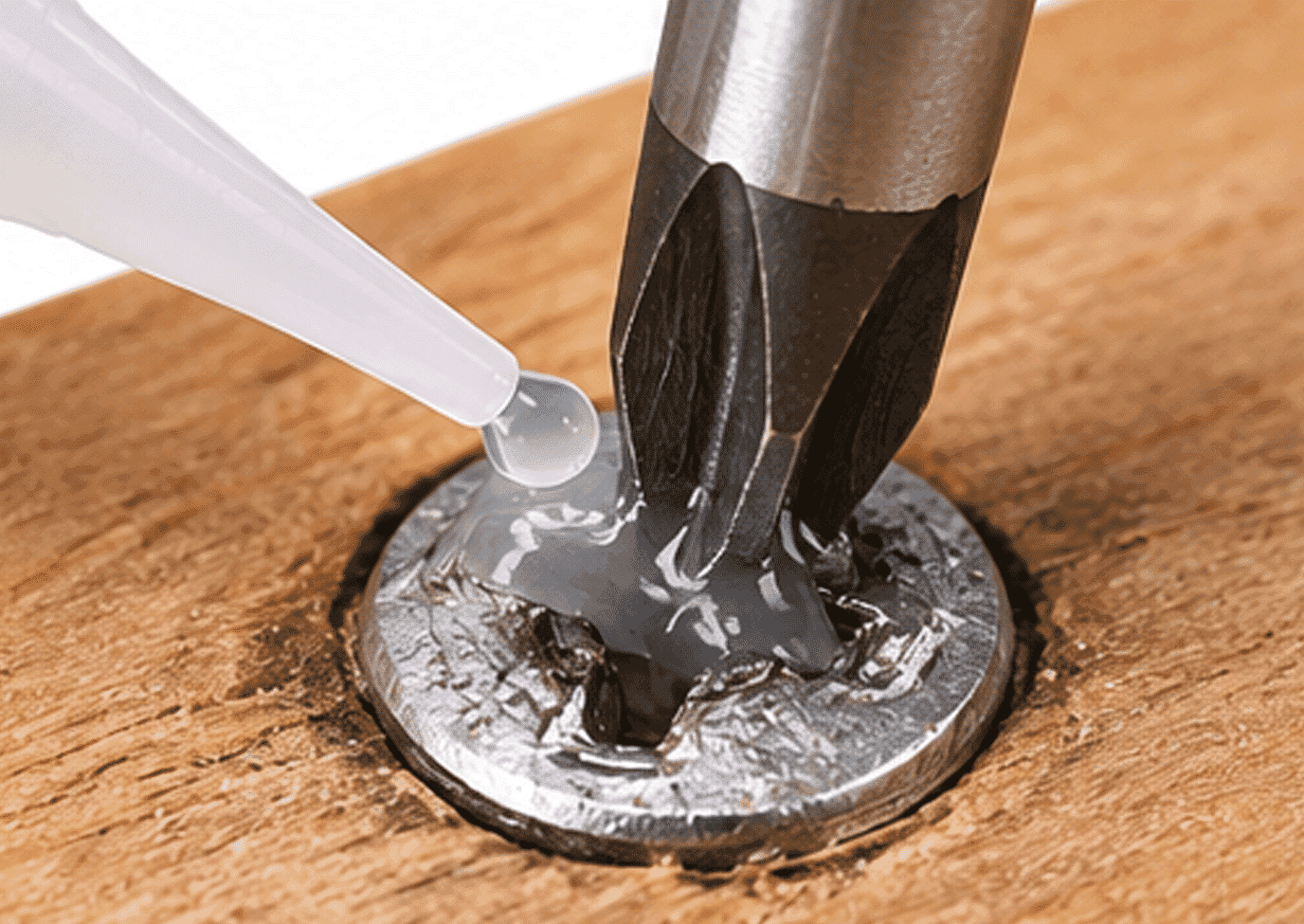 Super glue method showing a screwdriver bonded to a stripped screw head